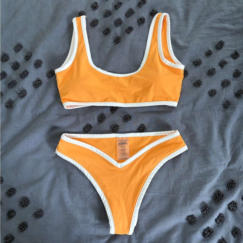 Kittenish orange and white bikini set